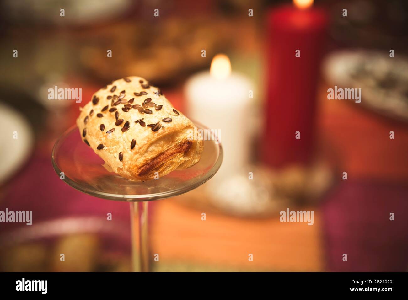 golden puff pastry rolls filled with salty ingredients on a glass plate Stock Photo Alamy