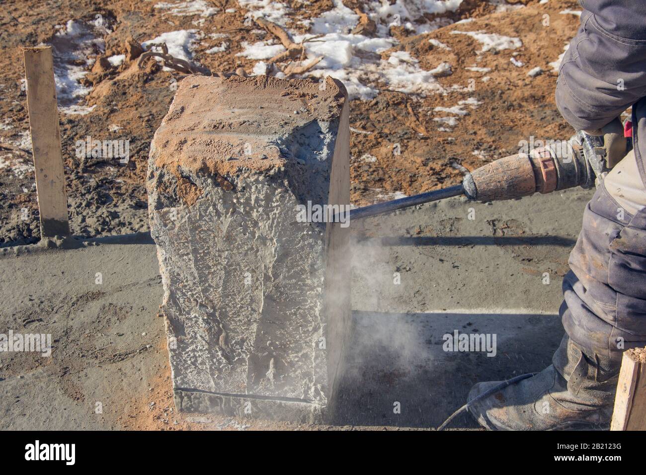 Electric jackhammer for demolition work. Professional worker at a