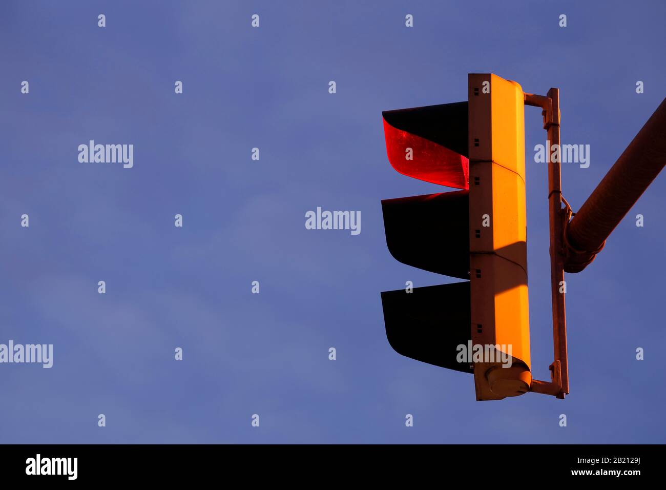 Traffic light shows red at dusk, Germany Stock Photo - Alamy