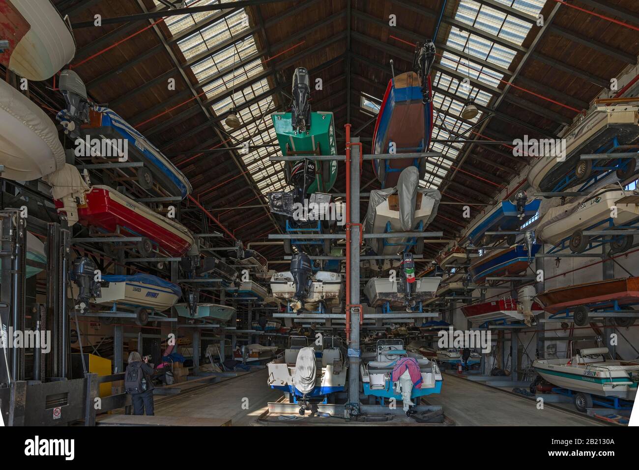 Warehouse for motorboats in a port on the island of Guidecca, Venice, Veneto, Italy Stock Photo