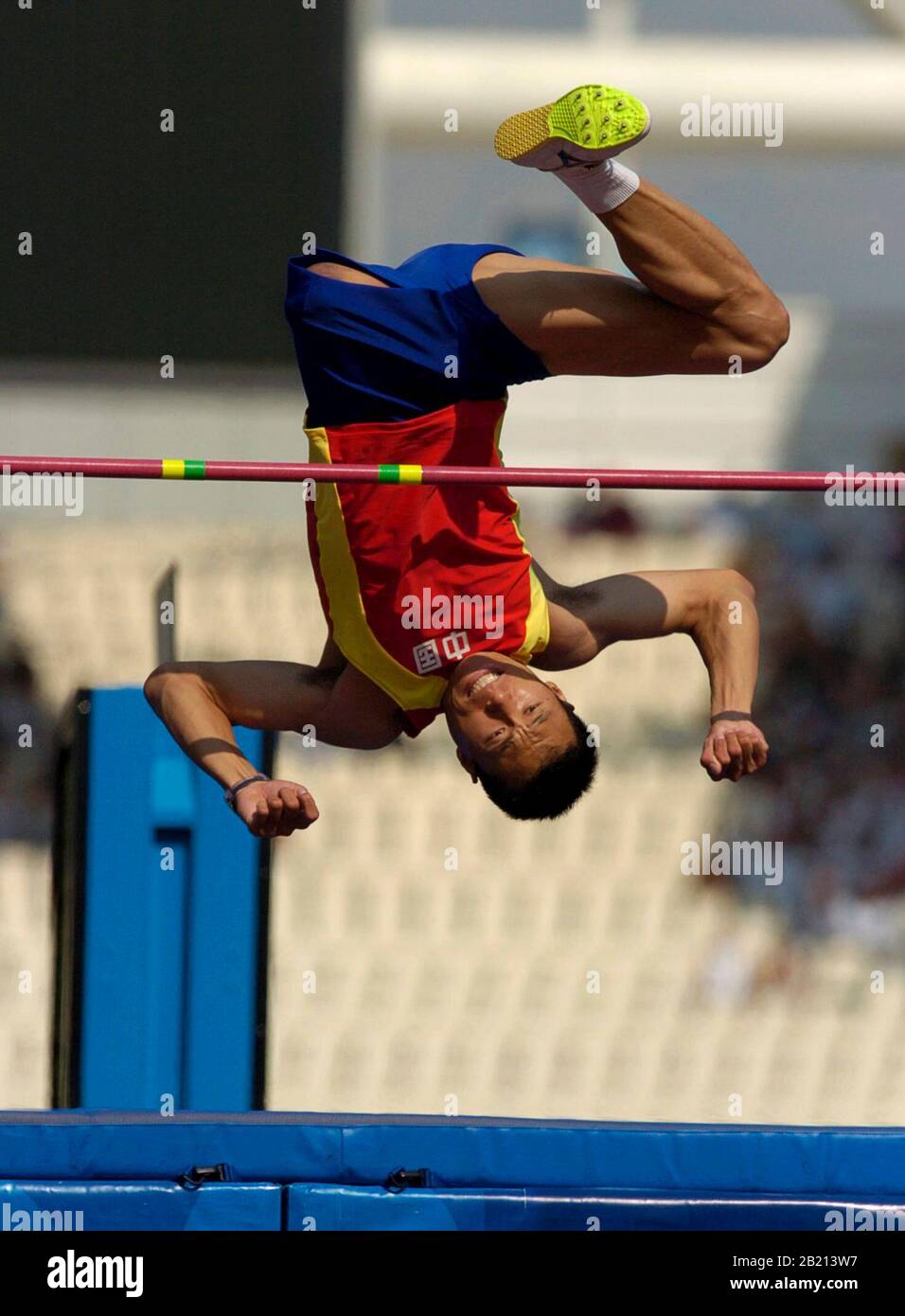 Athens, Greece: China's Bin Hou clears the high jump in the F42 class to win in 1.77 meters. September 23, 2004 ©Bob Daemmrich Stock Photo