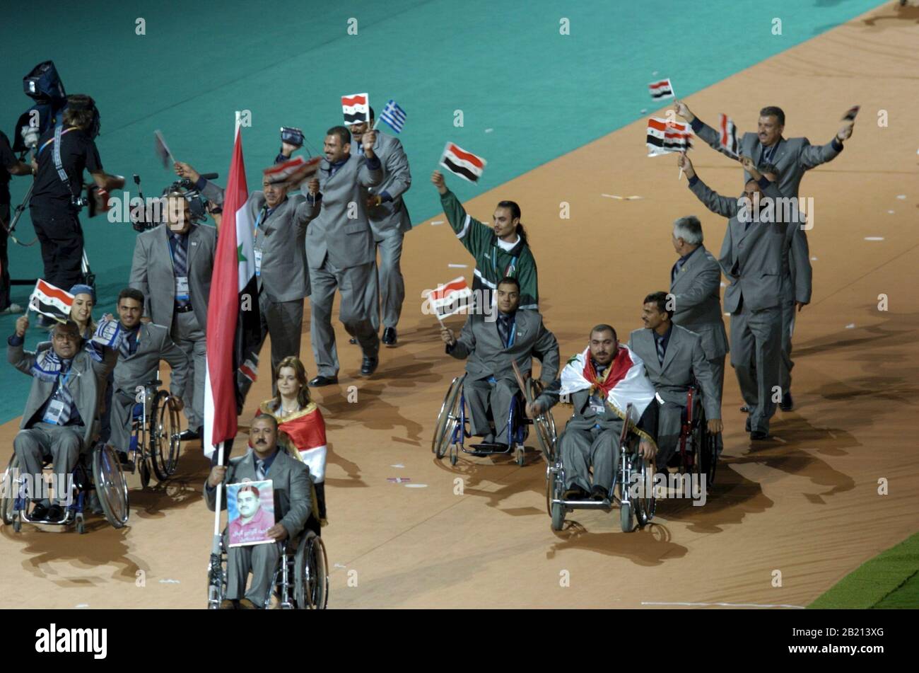 Athens, Greece 17SEP04:  Members of the Iraqi National Paralympic Team enter the Olympic Stadium Friday night for the opening ceremonies of the 10th Paralympic Games. The team got a rousing reception from the sellout crowd. ©Bob Daemmrich Stock Photo