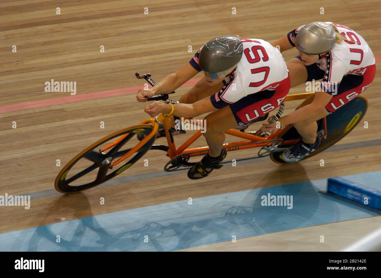Athens, Greece 18SEP04: Blind cyclist Karissa Whitsell (rear) and sighted  pilot Katie Compton of Team USA competing in the women's B13 tandem cycling 1-kilometer time trial final at the Athens Paralympic Games. The pair finished second for a silver medal. ©Bob Daemmrich Stock Photo