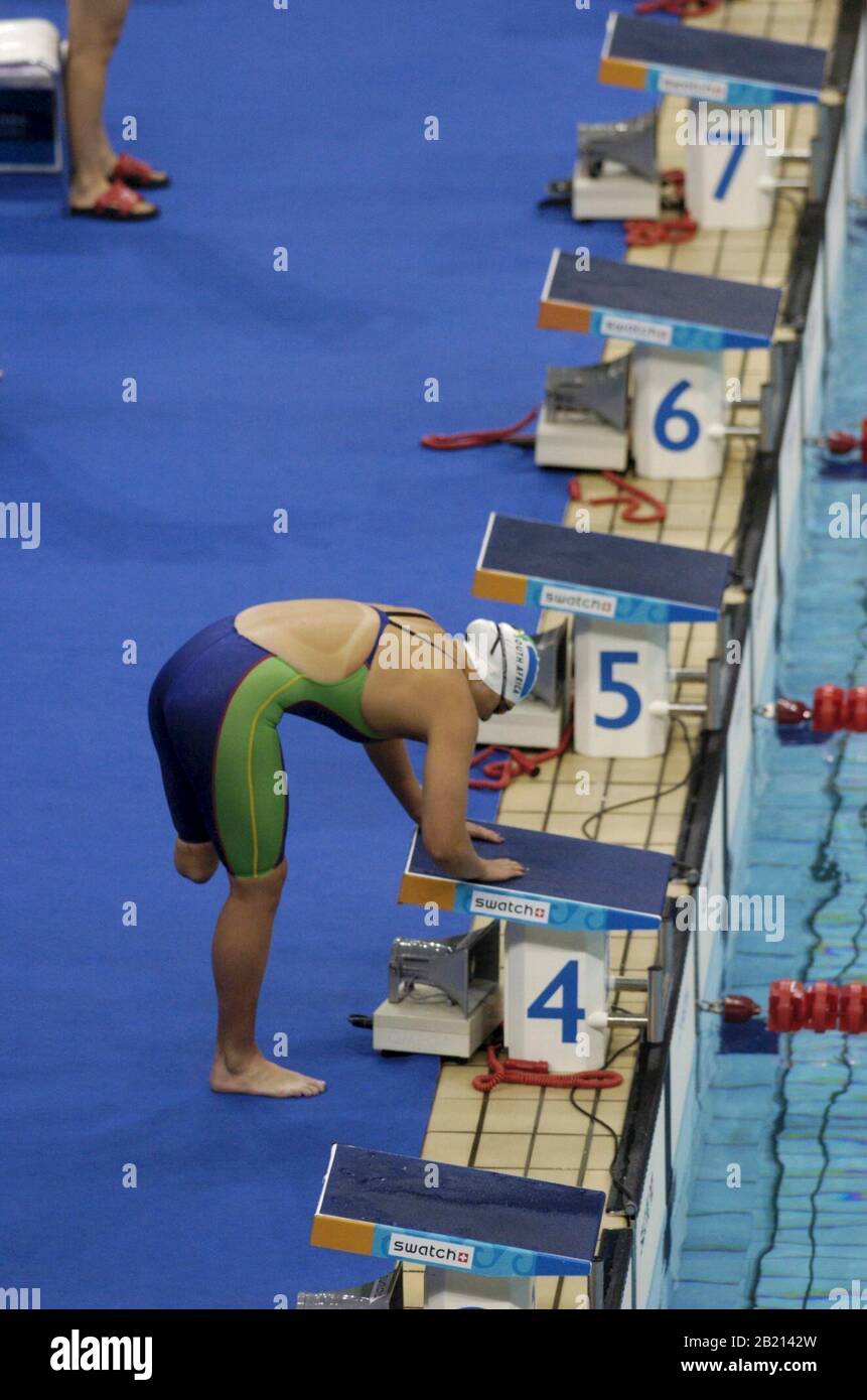 Athens, Greece  18SEP04:  South Africa's Natalie du Toit balances on the starting block before the women's 100-meter butterfly S9 category at the Athens Paralympic swimming. Du Toit set a world record in the event at 1:07.69 clocking. ©Bob Daemmrich Stock Photo