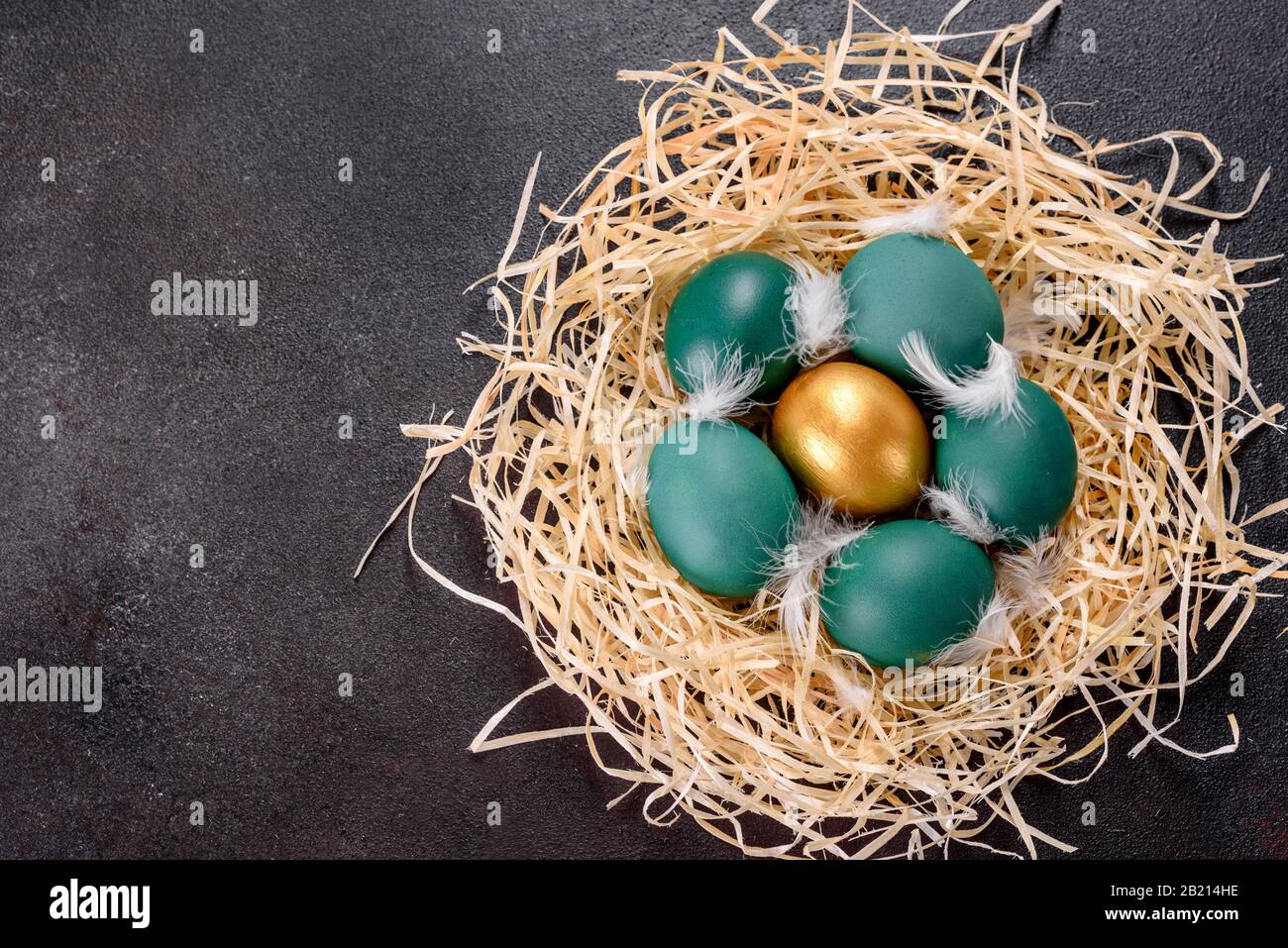 Easter golden eggs in the nest, preparation for the holiday. Golden