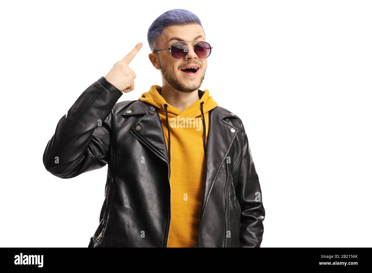 Cool young guy pointing at his blue dyed hair isolated on white background Stock Photo
