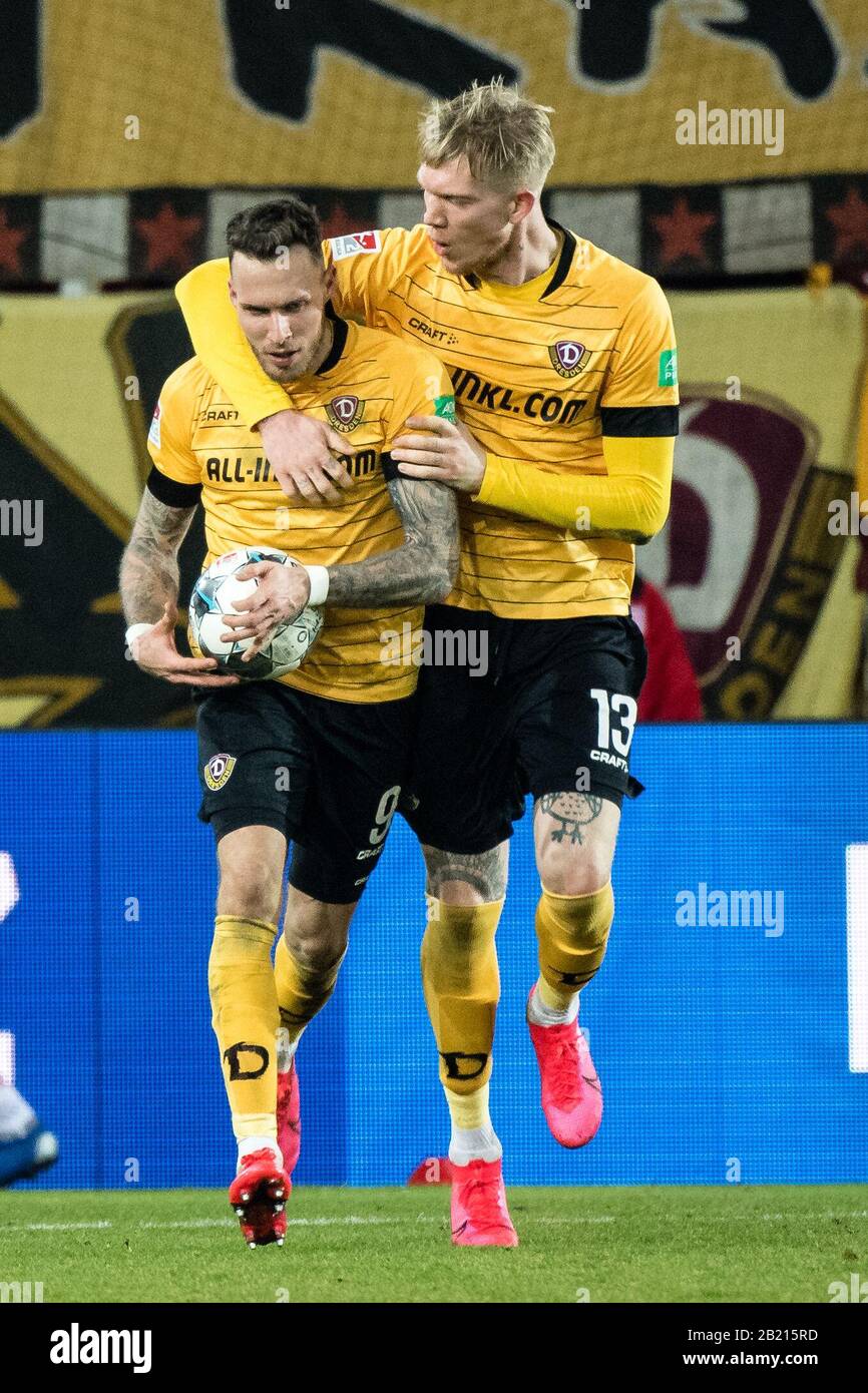 Regensburg, Germany. 28th Feb, 2020. Football: 2nd Bundesliga, Jahn Regensburg - Dynamo Dresden, 24th matchday in the Continental Arena. Goalscorer Patrick Schmidt (l) cheers with Simon Makienok Christoffersen from Dynamo Dresden about his 1:1 goal. Credit: Matthias Balk/dpa - IMPORTANT NOTE: In accordance with the regulations of the DFL Deutsche Fußball Liga and the DFB Deutscher Fußball-Bund, it is prohibited to exploit or have exploited in the stadium and/or from the game taken photographs in the form of sequence images and/or video-like photo series./dpa/Alamy Live News Stock Photo