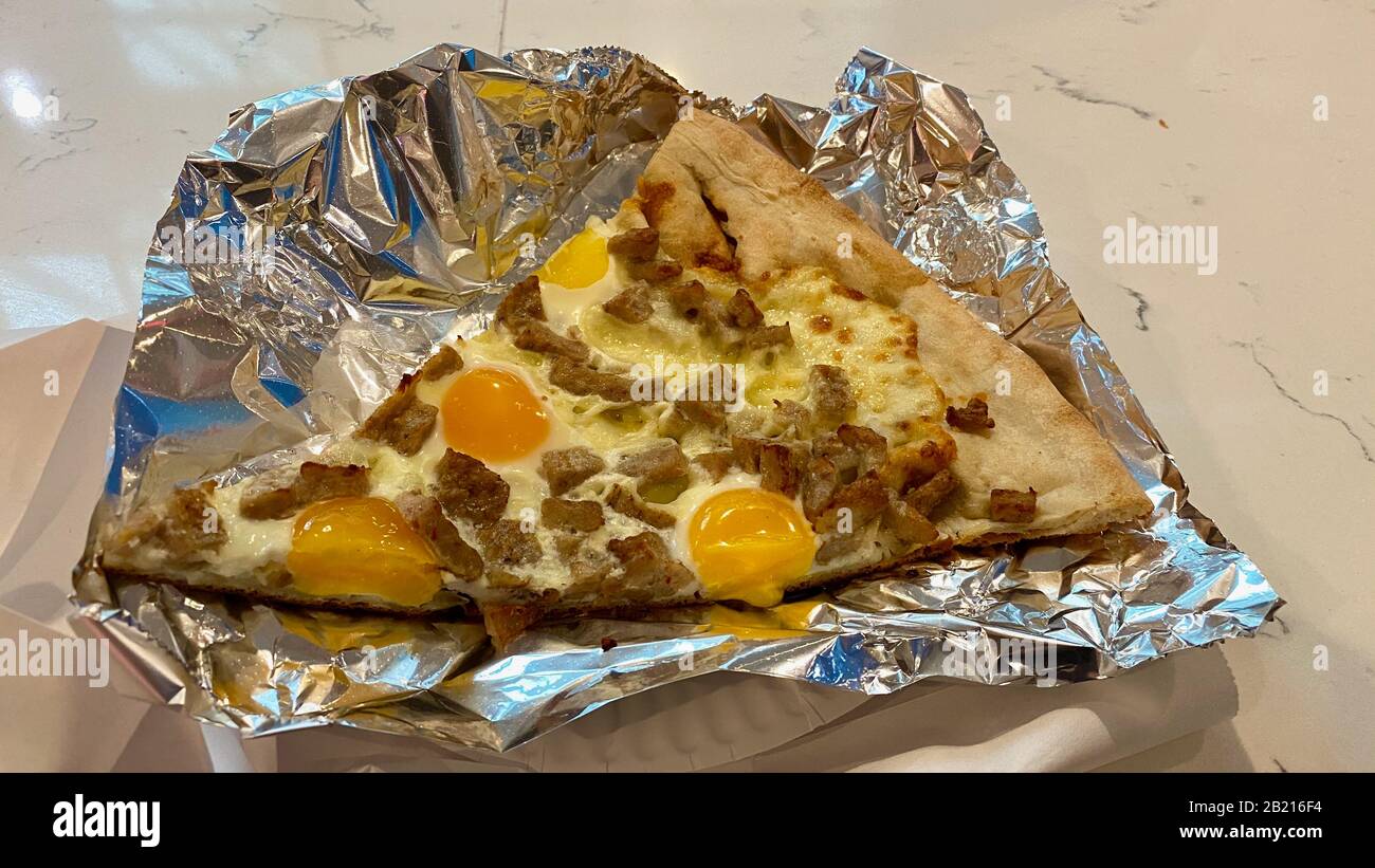 Sausage and eggs pizza on aluminum foil Stock Photo Alamy