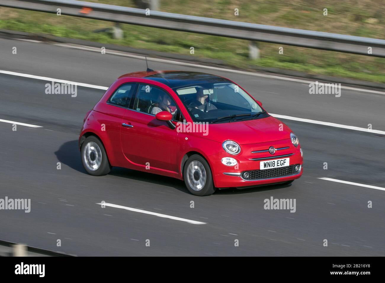 WN18EGF 2018 Fiat 500 Lounge Red Car Petrol driving on the M6 motorway near Chorley in Lancashire, UK Stock Photo