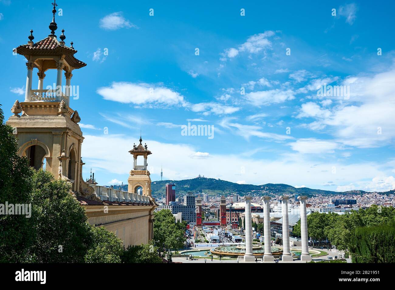 BARCELONA, SPAIN - MAY 13, 2017: View from Montjuic with towers surrounding the Palau Nacional, the Four Columns and the city of Barcelona. Venetian T Stock Photo