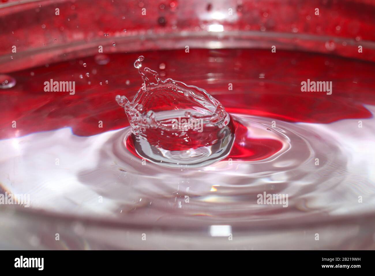 Water splash drops red and white macro Stock Photo