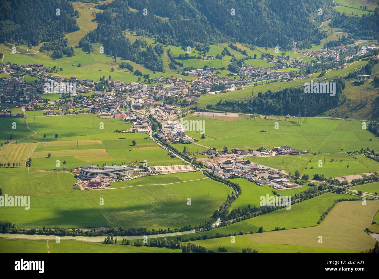 Aerial view of the town of Kaprun in Austria. City surrounded by Tirol Alps mountains. View from above. Stock Photo