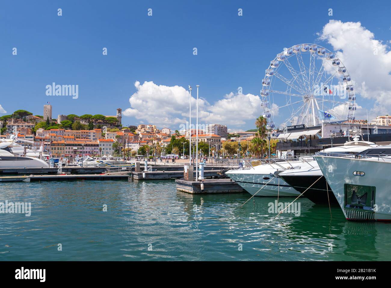 Cannes, France - August 14, 2018: Seaside view of Cannes with Esplanade Pantiero. Ordinary people walk the street Stock Photo