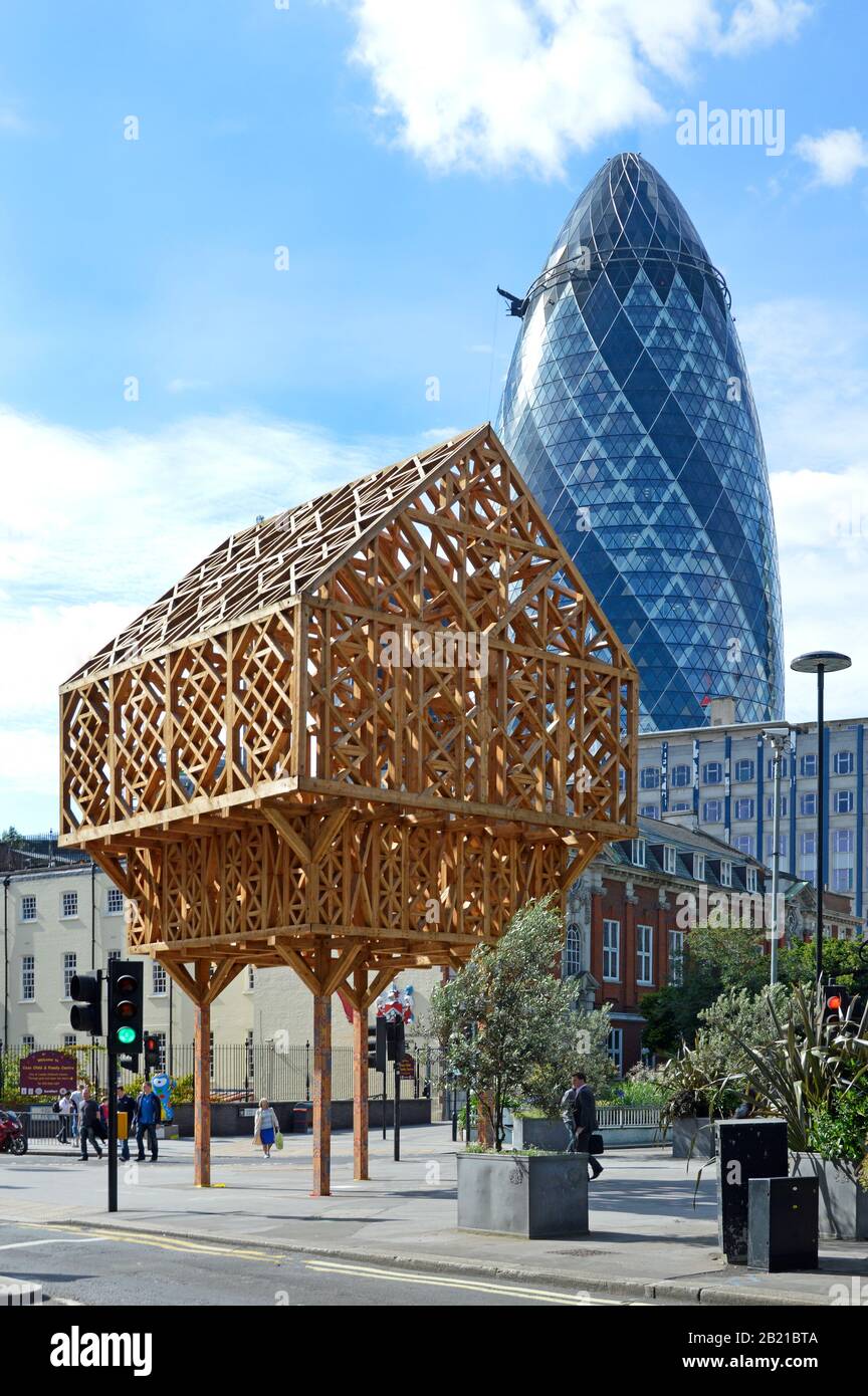 Paleys upon Pilers larch wood timber frame building at site where Geoffrey Chaucer lived Aldgate Gherkin landmark skyscraper office building London UK Stock Photo
