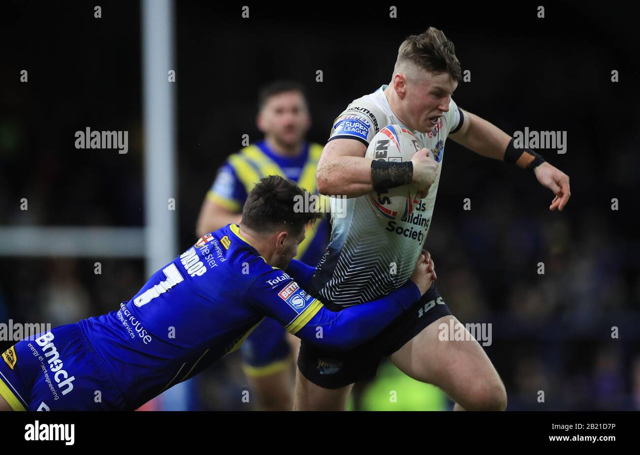 Leeds Rhinos' Harry Newman is tackled by Warrington Wolves' Gareth Widdop during the Betfred Super League match at Emerald Headingley Stadium, Leeds. Stock Photo