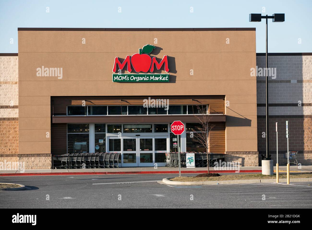 A logo sign outside of a MOM's Organic Market retail grocery store location in Nottingham, Maryland on February 22, 2020. Stock Photo