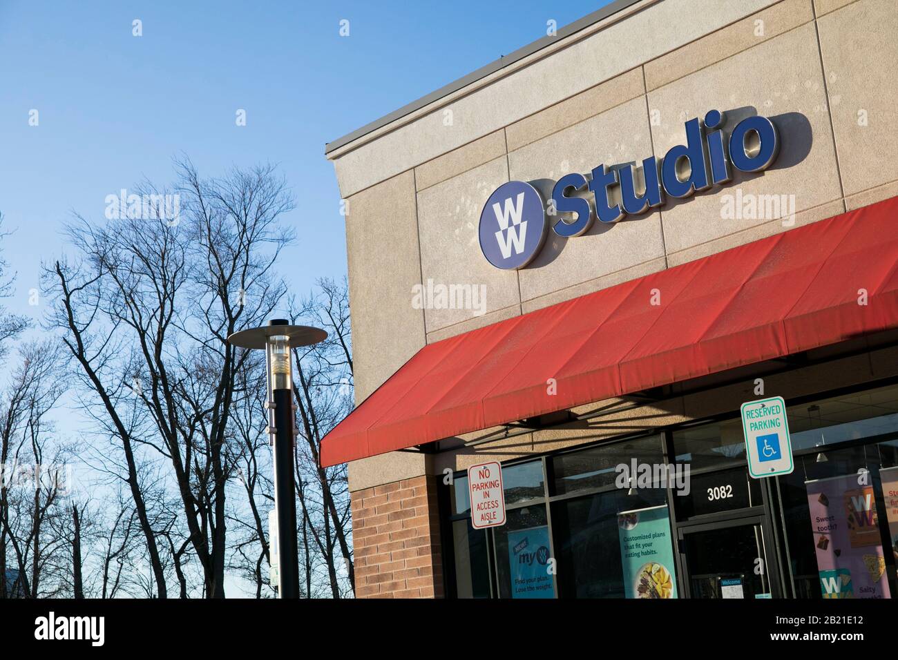 A logo sign outside of a Weight Watchers Studio location in Waldorf