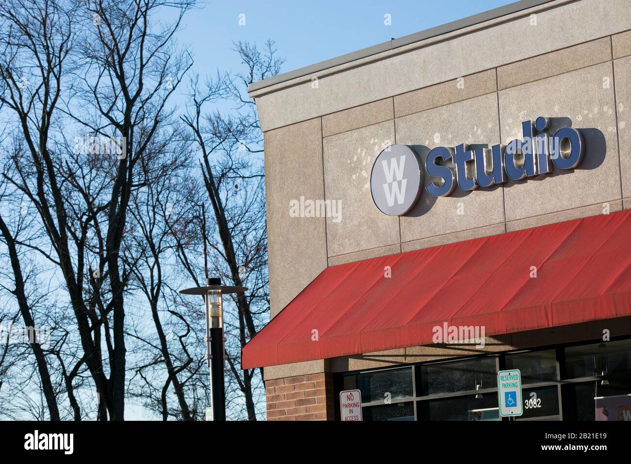 A logo sign outside of a Weight Watchers Studio location in Waldorf