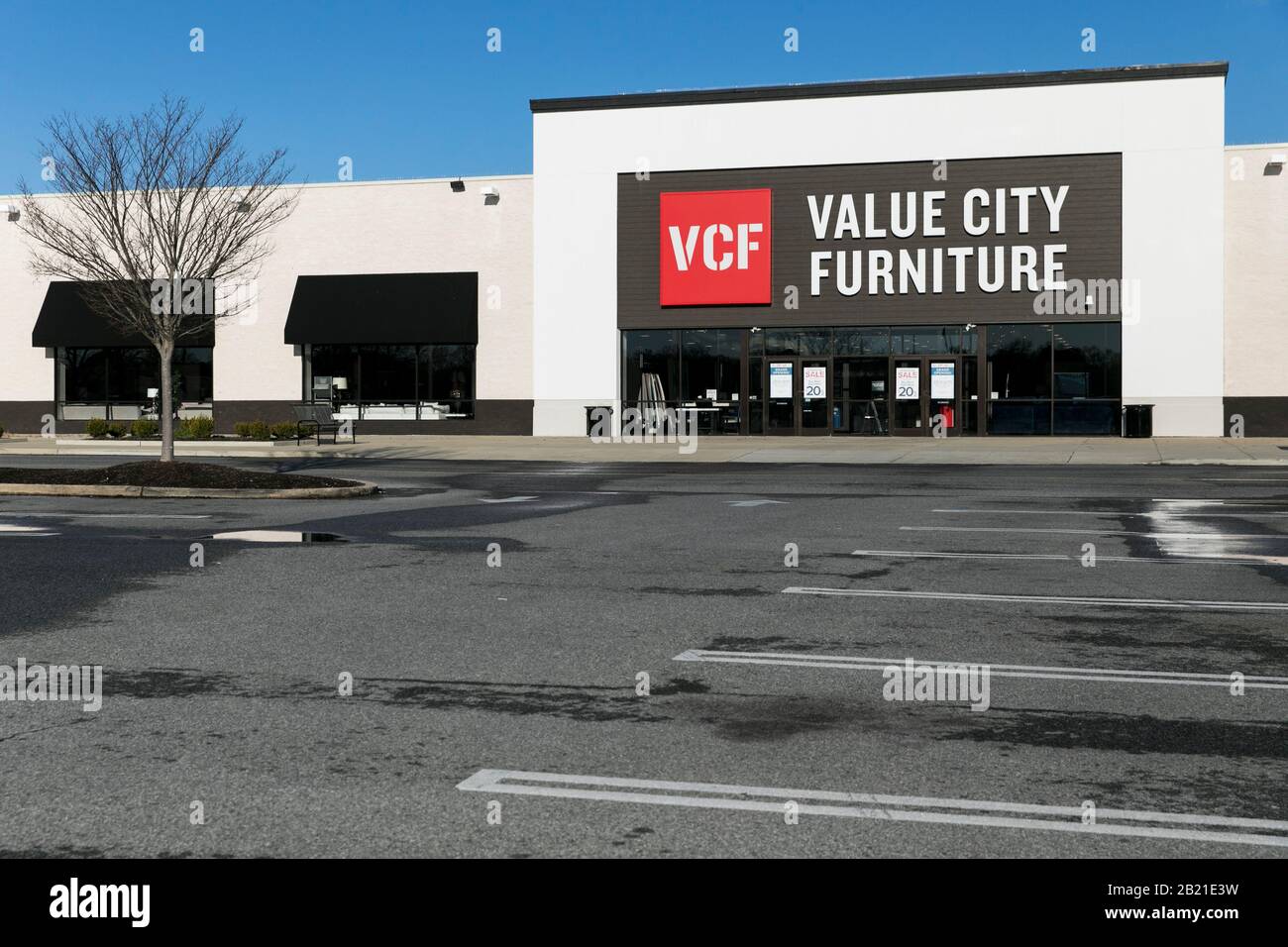 A Logo Sign Outside Of A Value City Furniture Vcf Retail Store