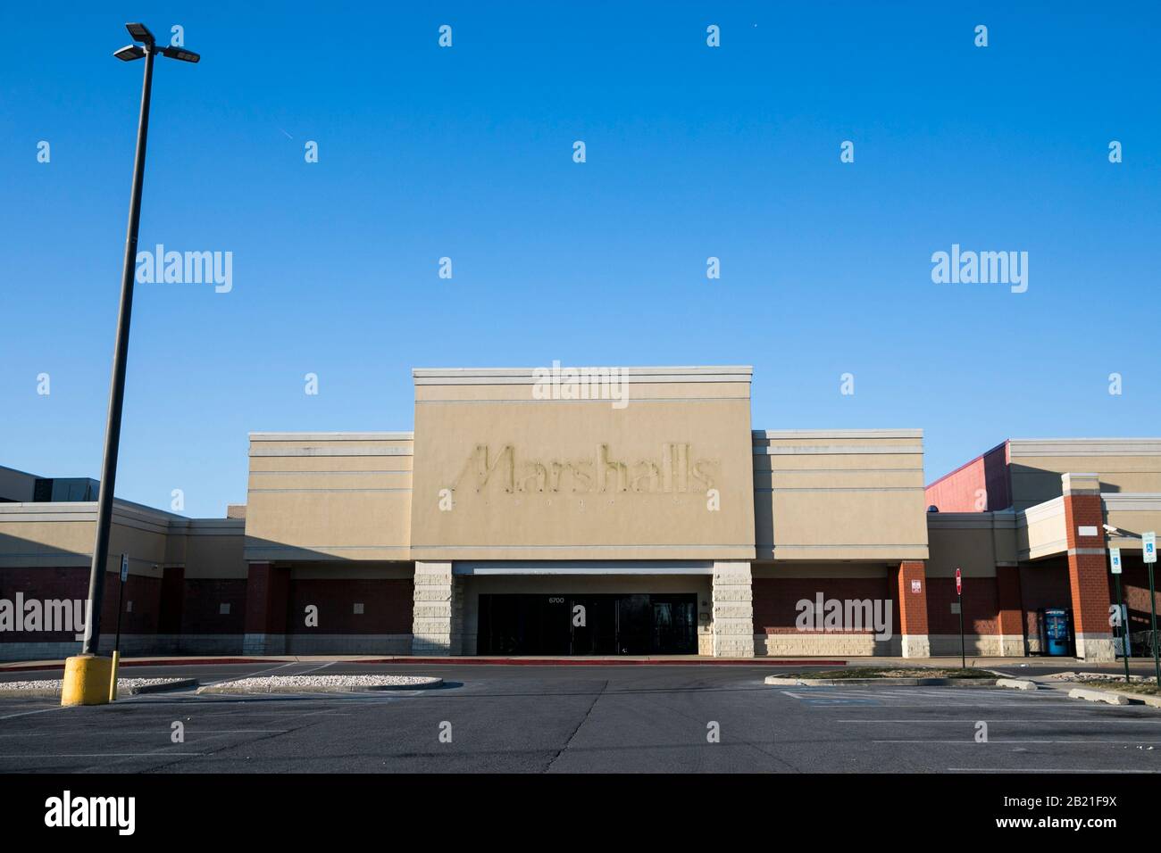 The faded outline of a Marshalls logo sign outside of a closed retail