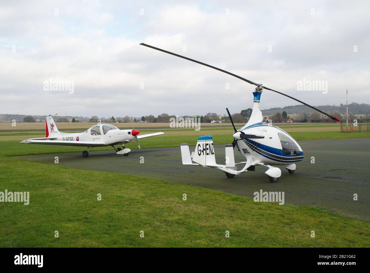 Parked Auto giro and single engined light aircraft. Wolverhampton Halfpenny Green Airport. South Staffordshire. UK Stock Photo