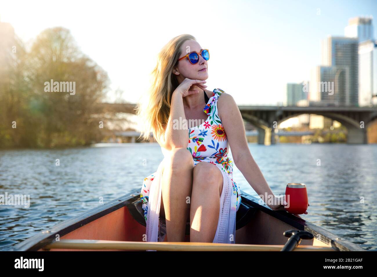 Pretty commercial model in boat, leisure summer activity city lifestyle, outdoors, enjoying life Stock Photo