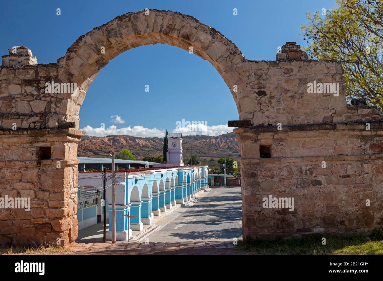 Yanhuitlan, Oaxaca, Mexico - The Presidencia Municipal, the town's government offices, framed by an arch at the Templo de Santo Domingo, a 16th centur Stock Photo