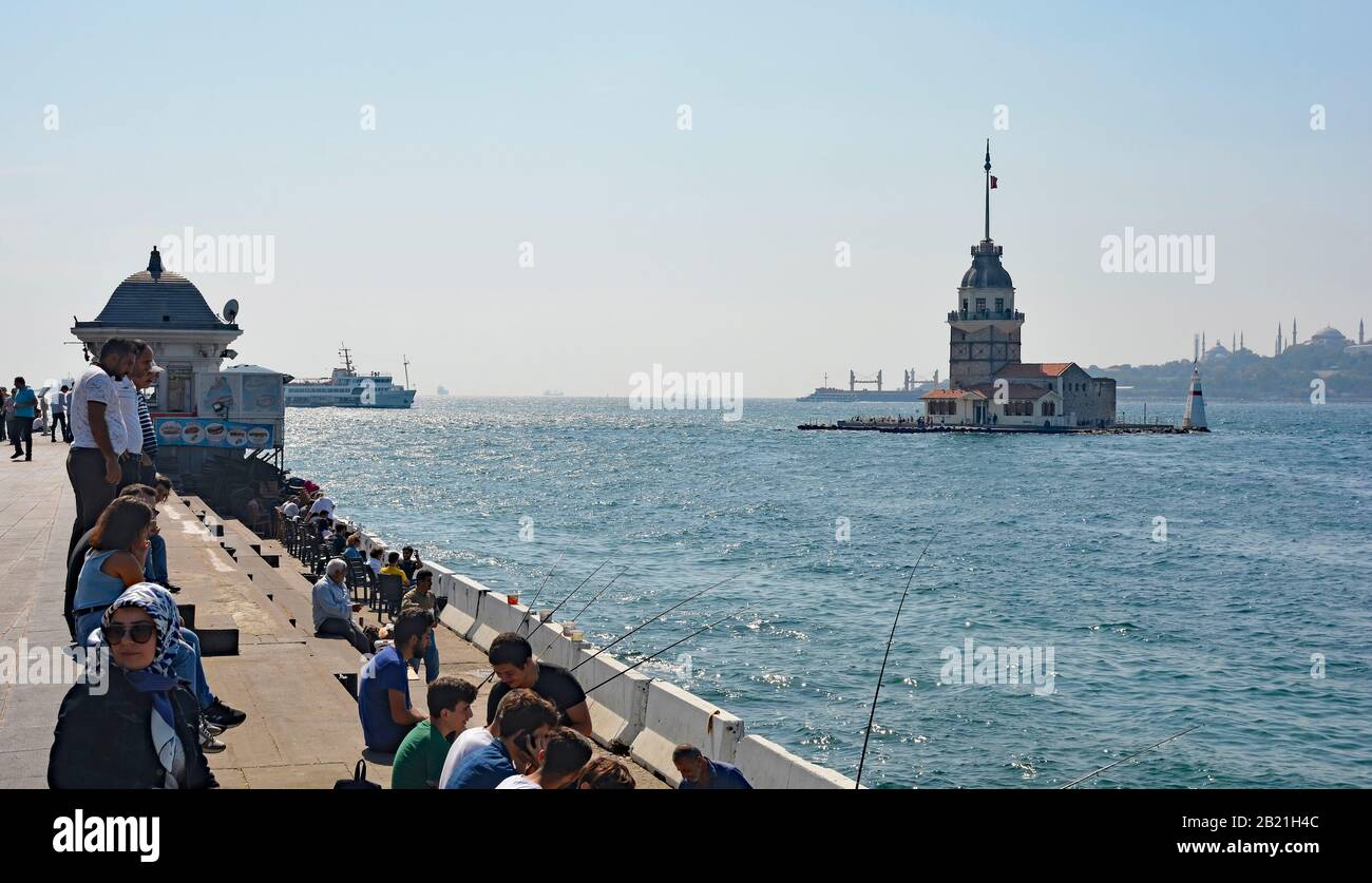 Istanbul, Turkey - September 17th 2019. Tourists and locals enjoy the view of the Bosphorus and Maiden's Tower from the Uskudar waterfront on the Asia Stock Photo