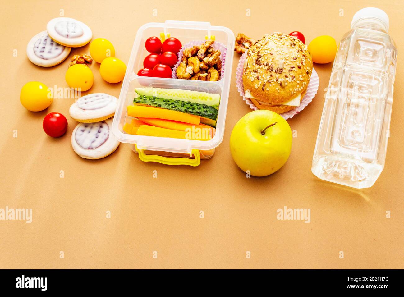 https://c8.alamy.com/comp/2B21H7G/school-lunch-box-with-sandwich-fresh-fruits-vegetables-water-and-nuts-healthy-eating-habits-for-kids-back-to-school-concept-on-bright-beige-back-2B21H7G.jpg