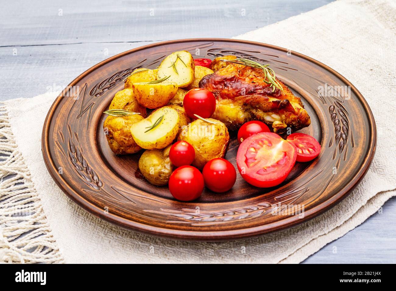 Roast chicken thighs and baby potatoes with soy sauce, maple syrup