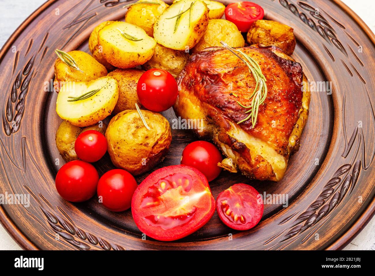 Roast chicken thighs and baby potatoes with soy sauce, maple syrup