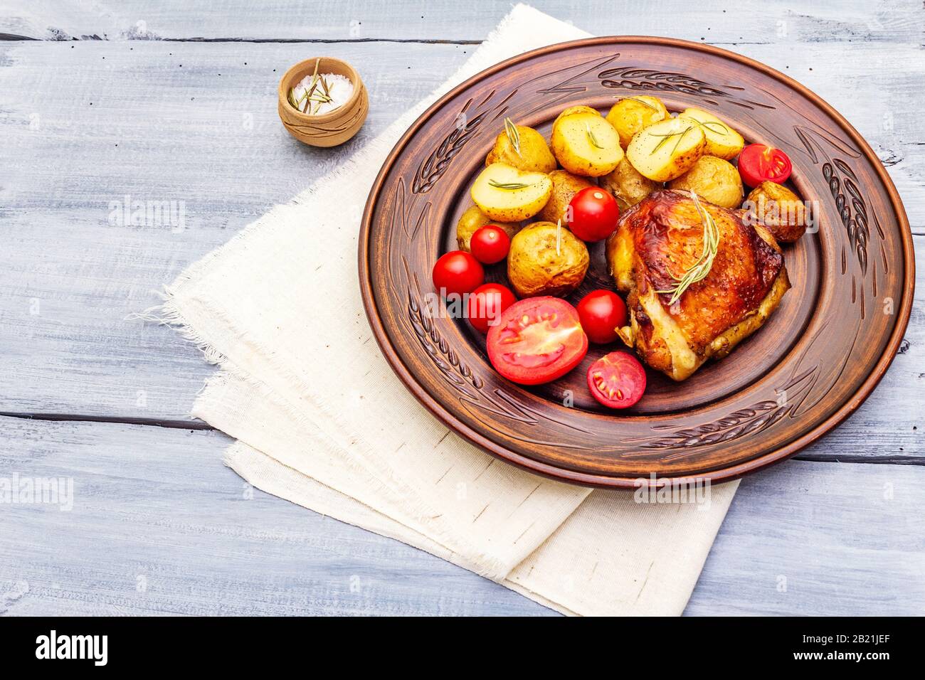 Roast chicken thighs and baby potatoes with soy sauce, maple syrup