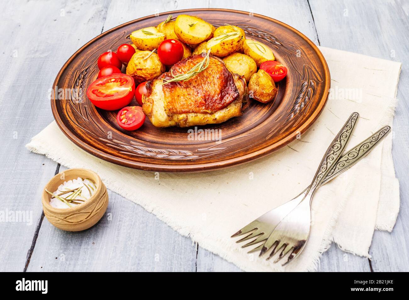 Roast chicken thighs and baby potatoes with soy sauce, maple syrup