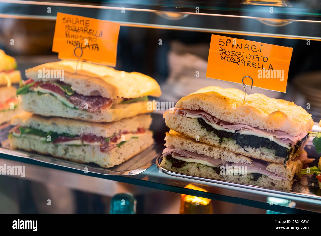 Display closeup of bread with mozzarella and prosciutto panini sandwich