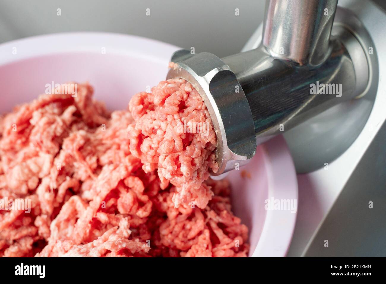 Detail of the grinding spike extruder still dirty and full of the meat it  has just ground Stock Photo - Alamy