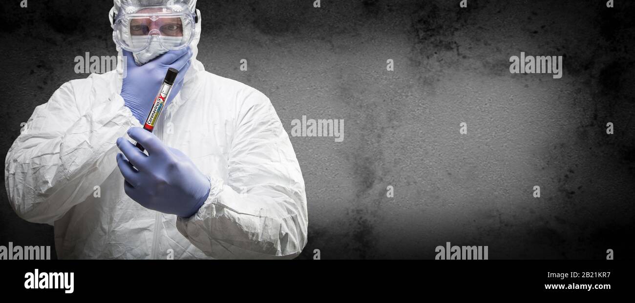 Male Doctor or Nurse In Hazmat Gear Holding Positive Coronavirus Test Tube Banner. Stock Photo