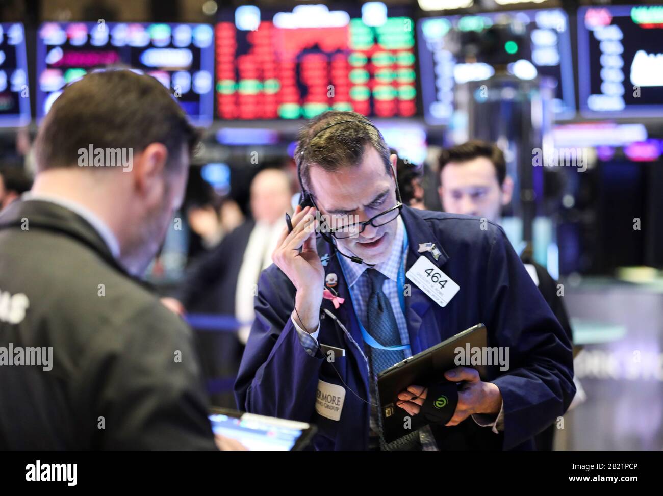 New York, USA. 28th Feb, 2020. Traders work at New York Stock Exchange in New York, the United States, on Feb. 28, 2020. U.S. stocks ended mixed on Friday. The Dow was down 1.39 percent to 25,409.36, the S&P 500 fell 0.82 percent to 2,954.22, and the Nasdaq was up 0.01 percent to 8,567.37. Credit: Wang Ying/Xinhua/Alamy Live News Stock Photo