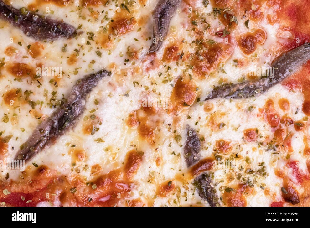 Pizza with tomato sauce, anchovies, mozzarella and oregano. Top view Stock Photo Alamy