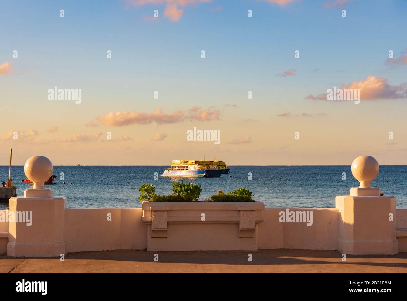 Cozumel, Quintana Roo, Mexico - February 4, 2019: View of the boardwalk and the sea with a lot of boats in Cozumel at sunset Stock Photo