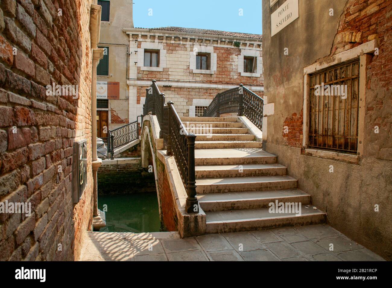 A small bridge over one of the back side canals. Venice, Italy. Stock Photo