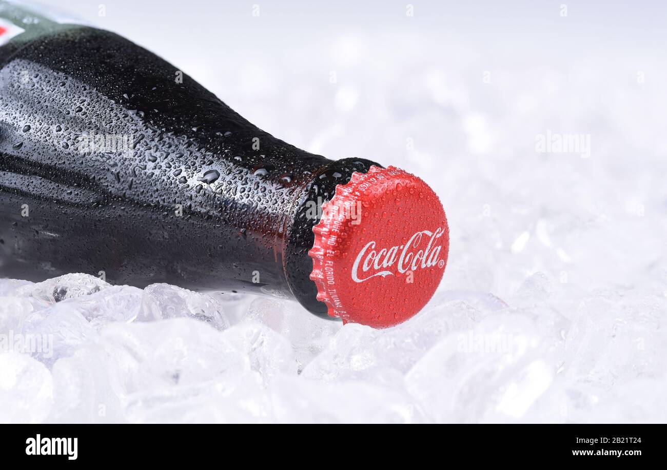 IRVINE, CALIFORNIA - FEBRUARY 7, 2017: Coca-Cola Bottle on ice. Introduced in 1886, the Atlanta based soft drink manufacturers products are available Stock Photo
