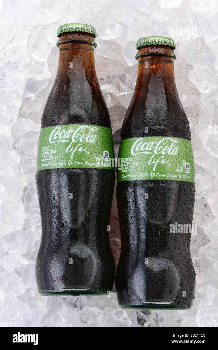 IRVINE, CA - FEBRUARY 15, 2015: Coca-Cola Life bottles on ice. A reduced calorie soft drink sweetened with cane sugar and Stevia, containing 60% of th Stock Photo