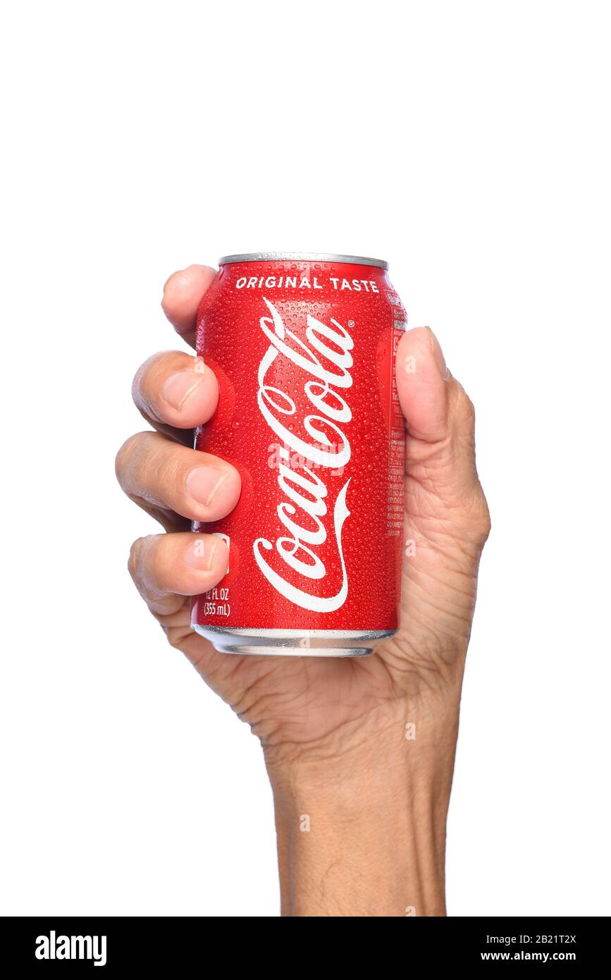 IRVINE, CALIFORNIA - APRIL 26, 2019: Closeup of a hand holding a cold can of  Coca-Cola. Stock Photo
