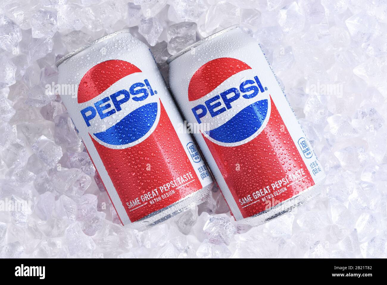 IRVINE, CALIFORNIA - MAY 23, 2018: Two cans of Pepsi-Cola on ice. Pepsi is one of the leading producers of soda and soft drinks in the USA. Stock Photo