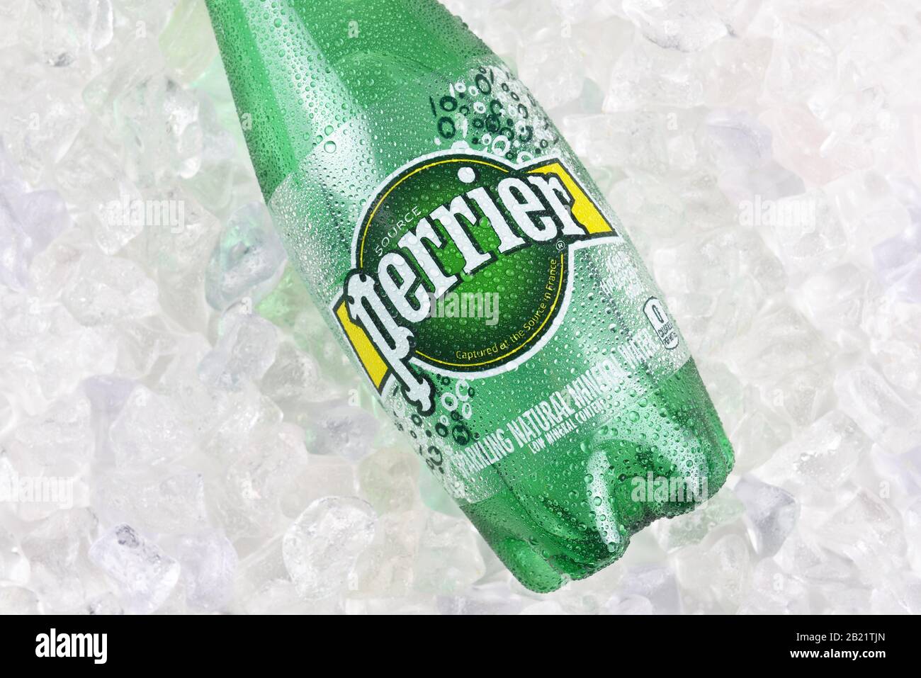 IRVINE, CALIFORNIA - DECEMBER 17, 2017: Perrier Sparkling Mineral Water on ice closeup. The spring, in Vergeze, France, where the water is sourced is Stock Photo