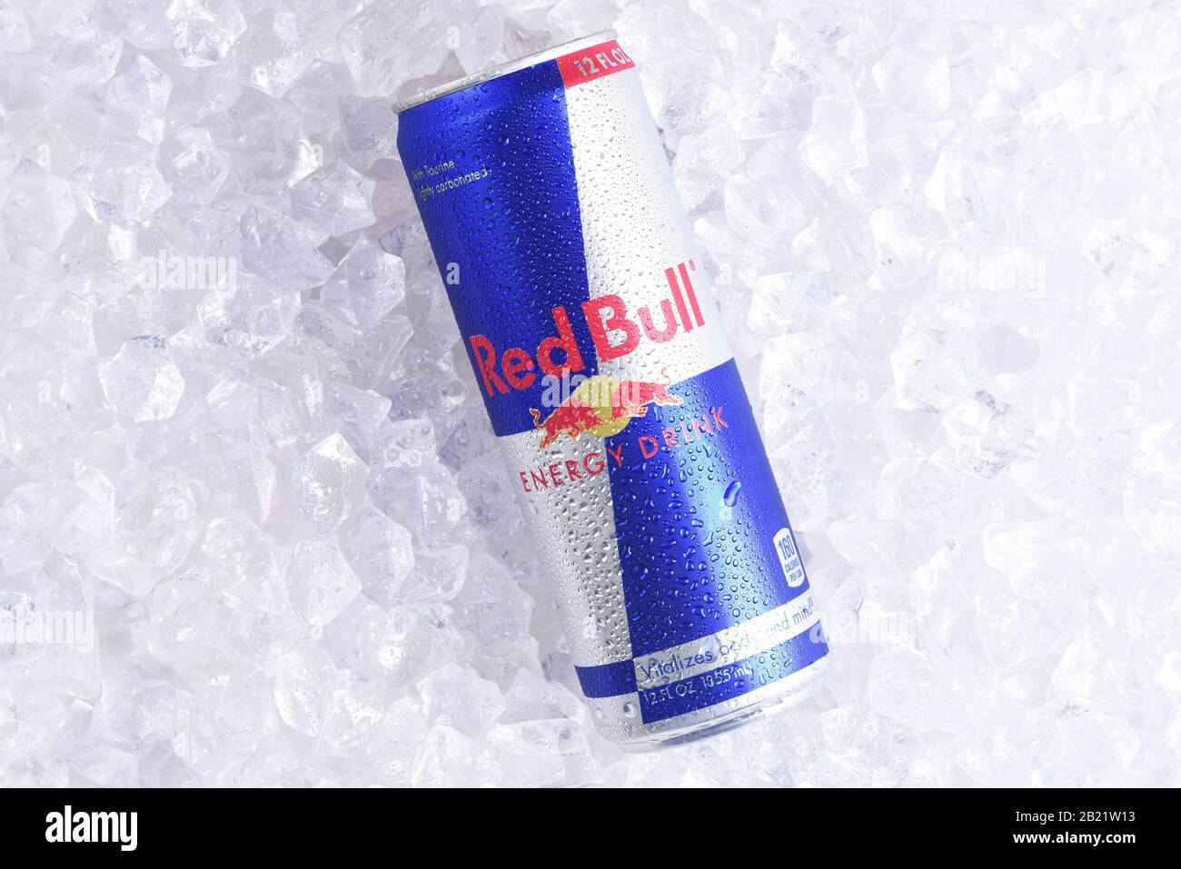 IRVINE, CALIFORNIA - MAY 23, 2018: A single can of Red Bull Energy Drink on ice. Red Bull is the most popular energy drink in the world. Stock Photo