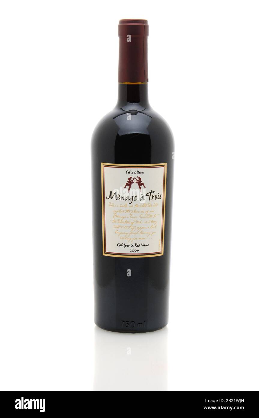 IRVINE, CA - January 11, 2013: A 750 ml bottle of Menage a Trois California Red Wine. Produced by the award winning winery Folie a Deux in Sonoma. Stock Photo