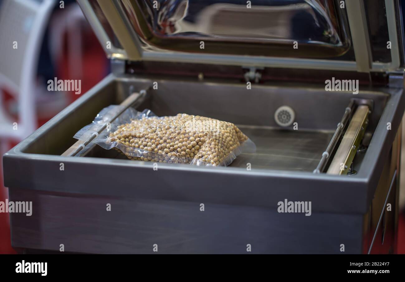 Heat sealing vacuum machine for food packaging Stock Photo Alamy