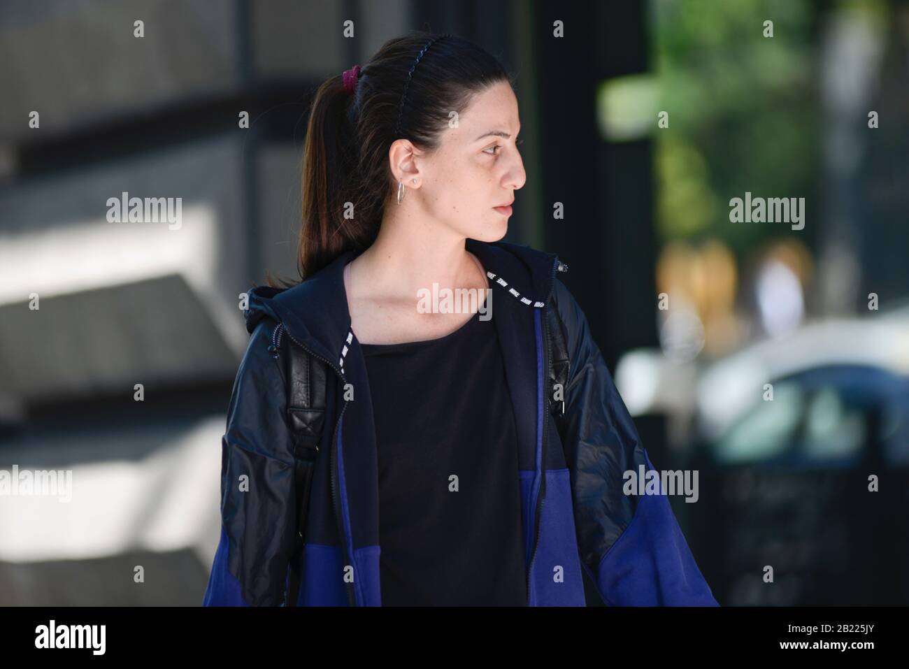 A young girl wearing sports clothes walking in Shota Rustaveli Avenue