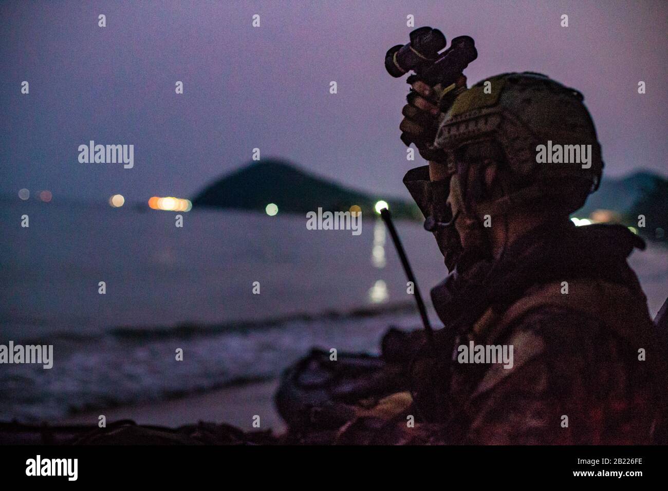 A U.S. Marine with the 31st Marine Expeditionary Unit’s Maritime Raid Force prepares his gear prior to a bilateral reconnaissance and surveillance insert with Royal Thai Marines at Hat Yao Beach, Kingdom of Thailand, Feb. 26, 2020, as part of Cobra Gold 2020. Exercise Cobra Gold 20, in its 39th iteration, is designed to advance regional security and ensure effective responses to regional crises by bringing together multinational forces to address shared goals and security commitments in the Indo-Pacific region. (U.S. Marine Corps photo by Cpl. Isaac Cantrell) Stock Photo